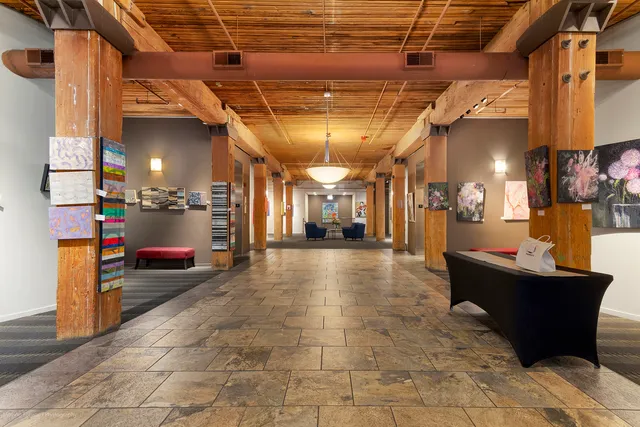 a view of a cars park in front of a building