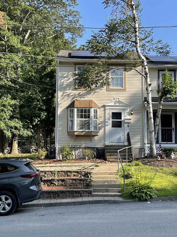 57 First Street Worcester, MA 01602 - Photo 1 of 26 a view of a car park in front of house