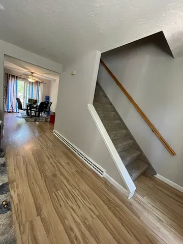 a view of a living room and entryway