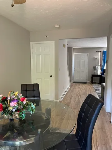 a living room with furniture and flowers