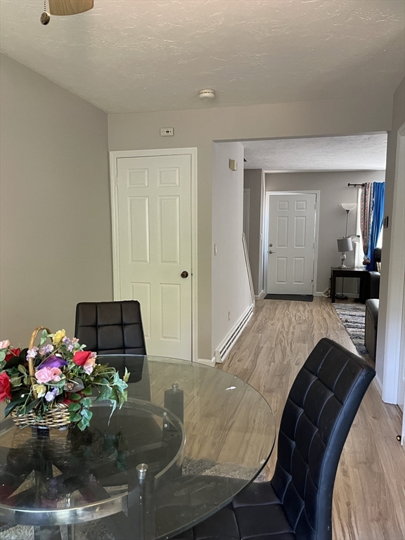 57 First Street Worcester, MA 01602 - Photo 17 of 26 a living room with furniture and flowers