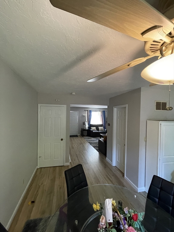 57 First Street Worcester, MA 01602 - Photo 19 of 26 a living room with furniture and a flat screen tv
