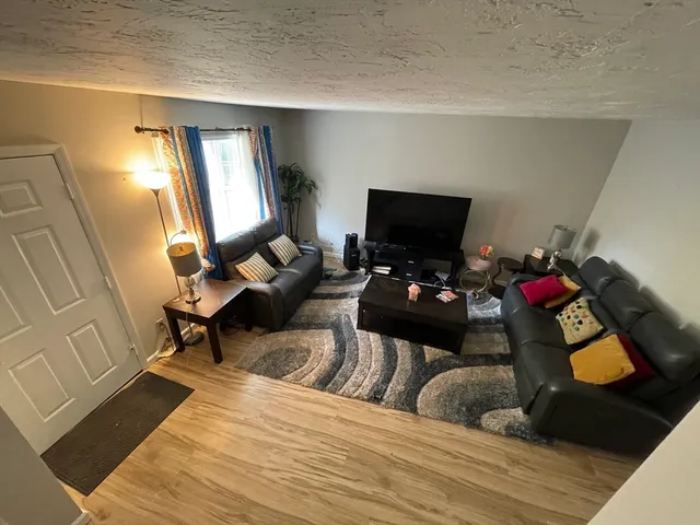 a bedroom with a bed and a mirror