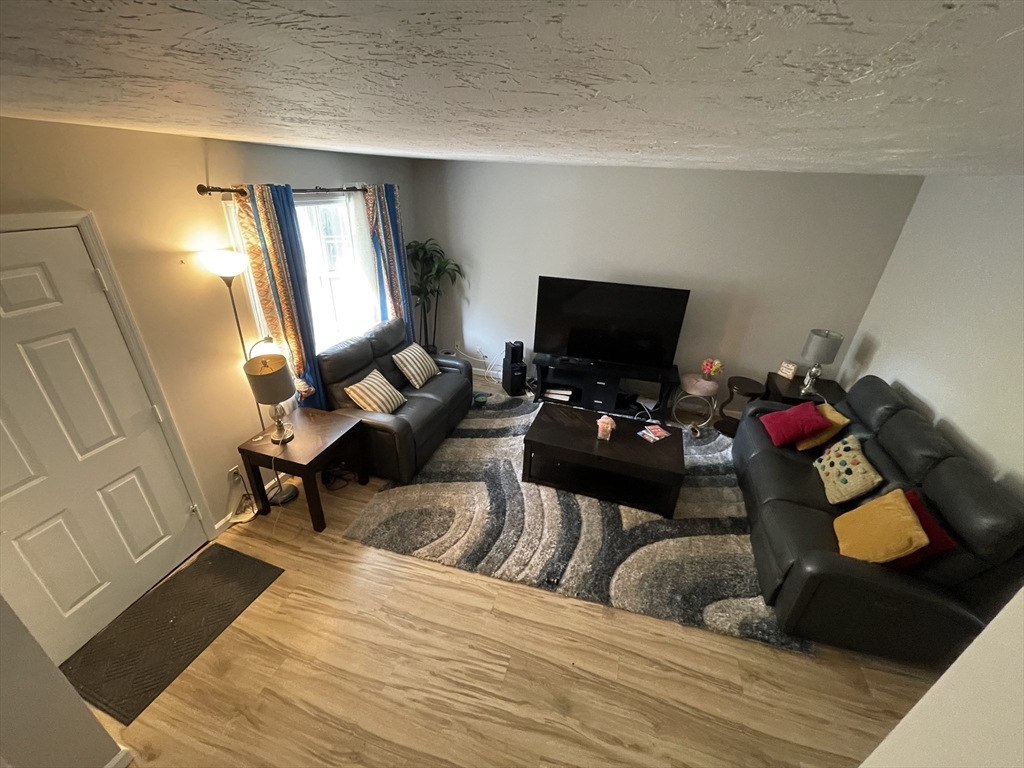 57 First Street Worcester, MA 01602 - Photo 2 of 26 a bedroom with a bed and a mirror