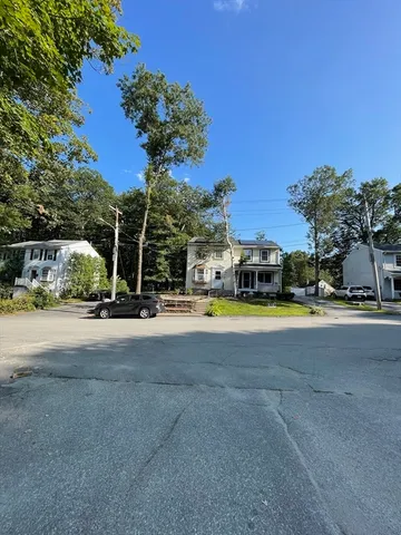 a view of street with parked cars