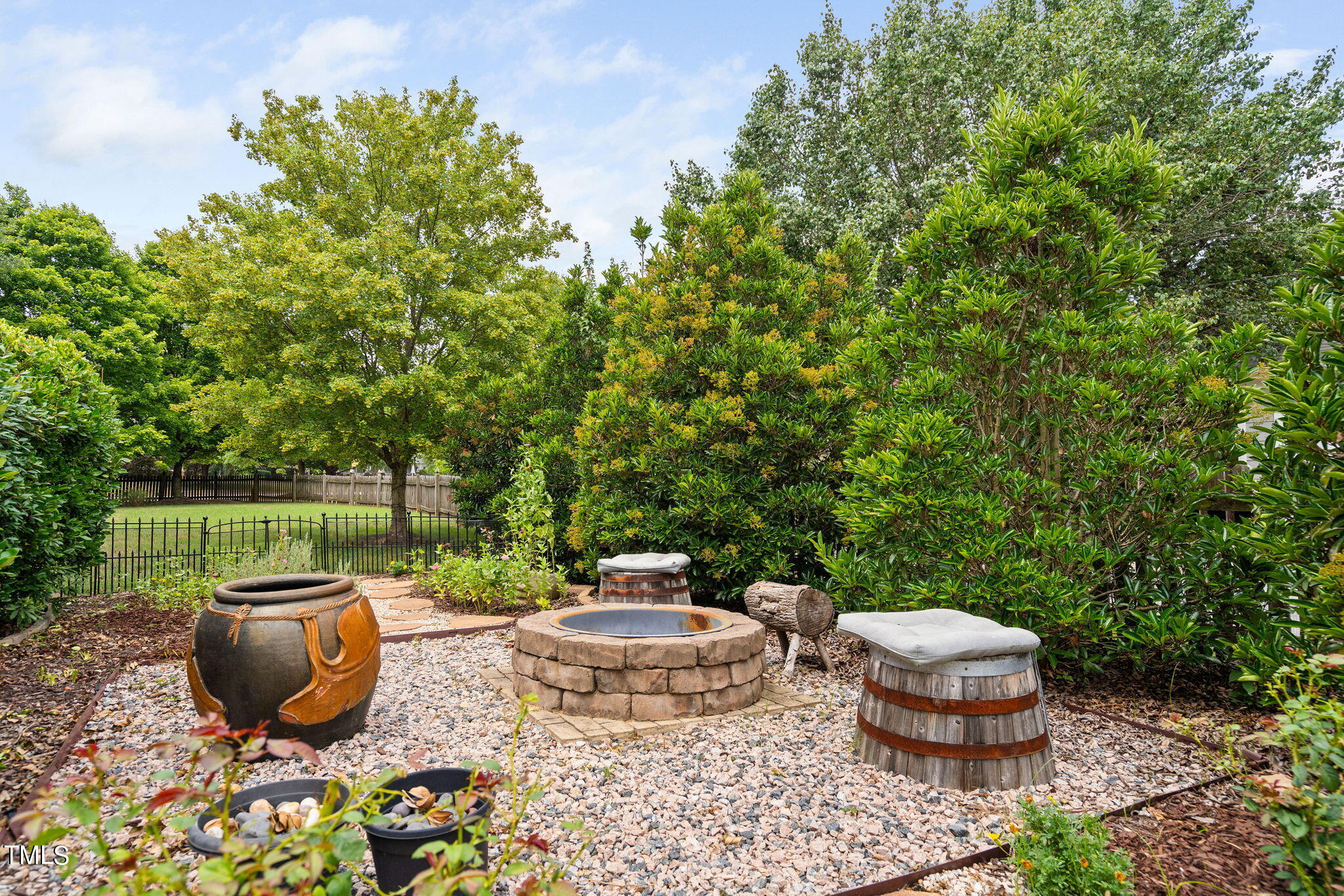 2251 Dunn Road Raleigh, NC 27614 - Photo 33 of 38 Firepit Surrounded By Roses & Perennials