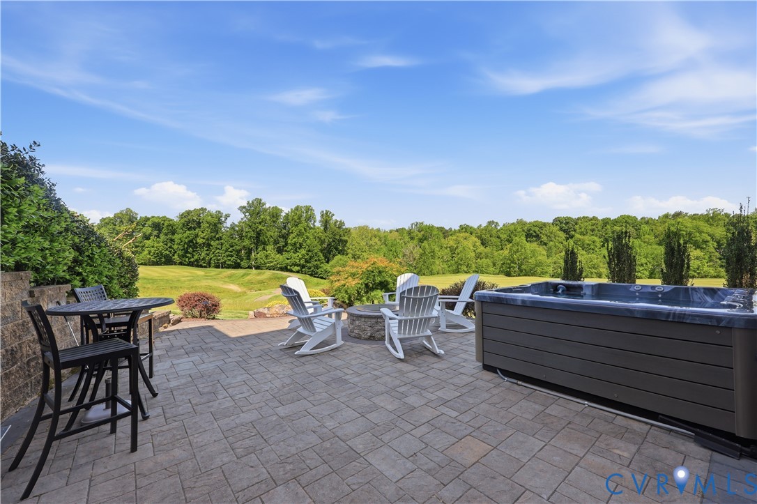 14849 Elliot Ridge Way Glen Allen, VA 23059 - Photo 62 of 78 Patio outside Basement with hot tub and fire pit.