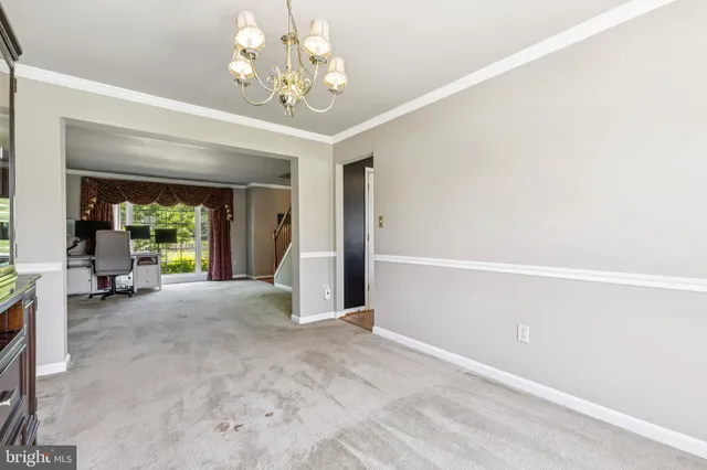 a view of a livingroom with a large window and couch
