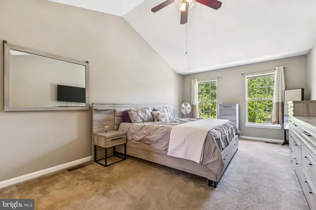 a bed room with a bed and a television