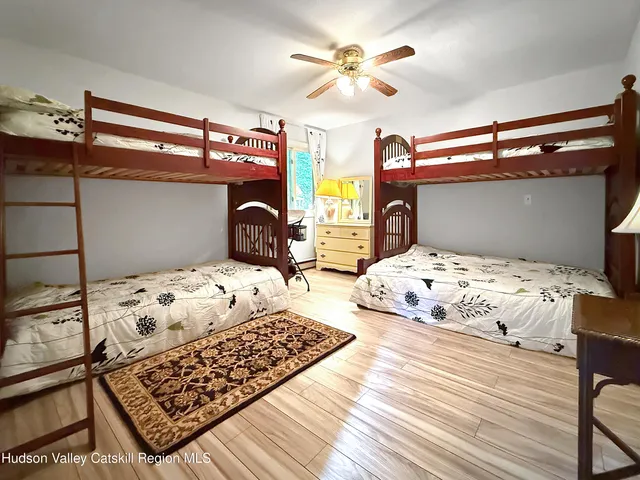a bedroom with double bed and a window