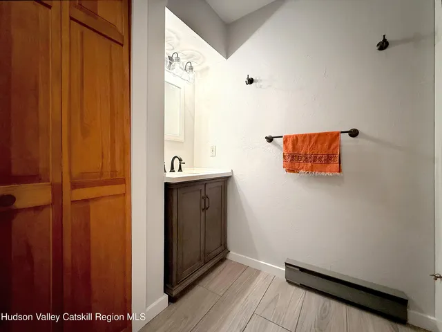 a view of front door with wooden floor