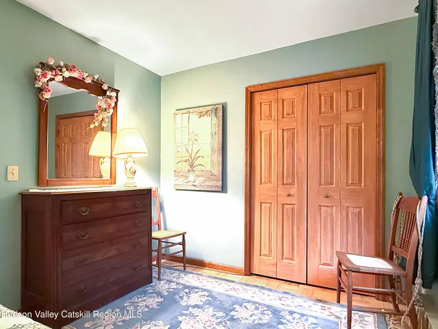 a room with a dresser and a window
