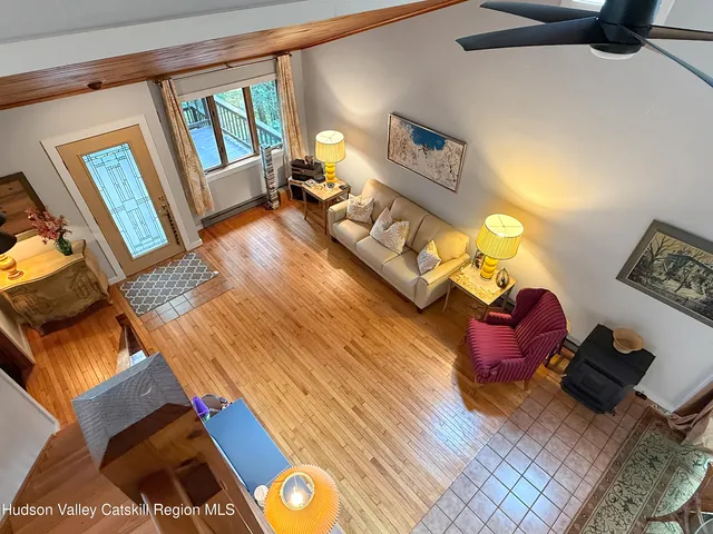 a bedroom with furniture and a wooden floor