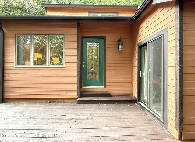 a view of a house with a door and a window