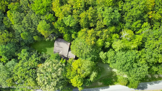 a backyard of a house with lots of green space and garden