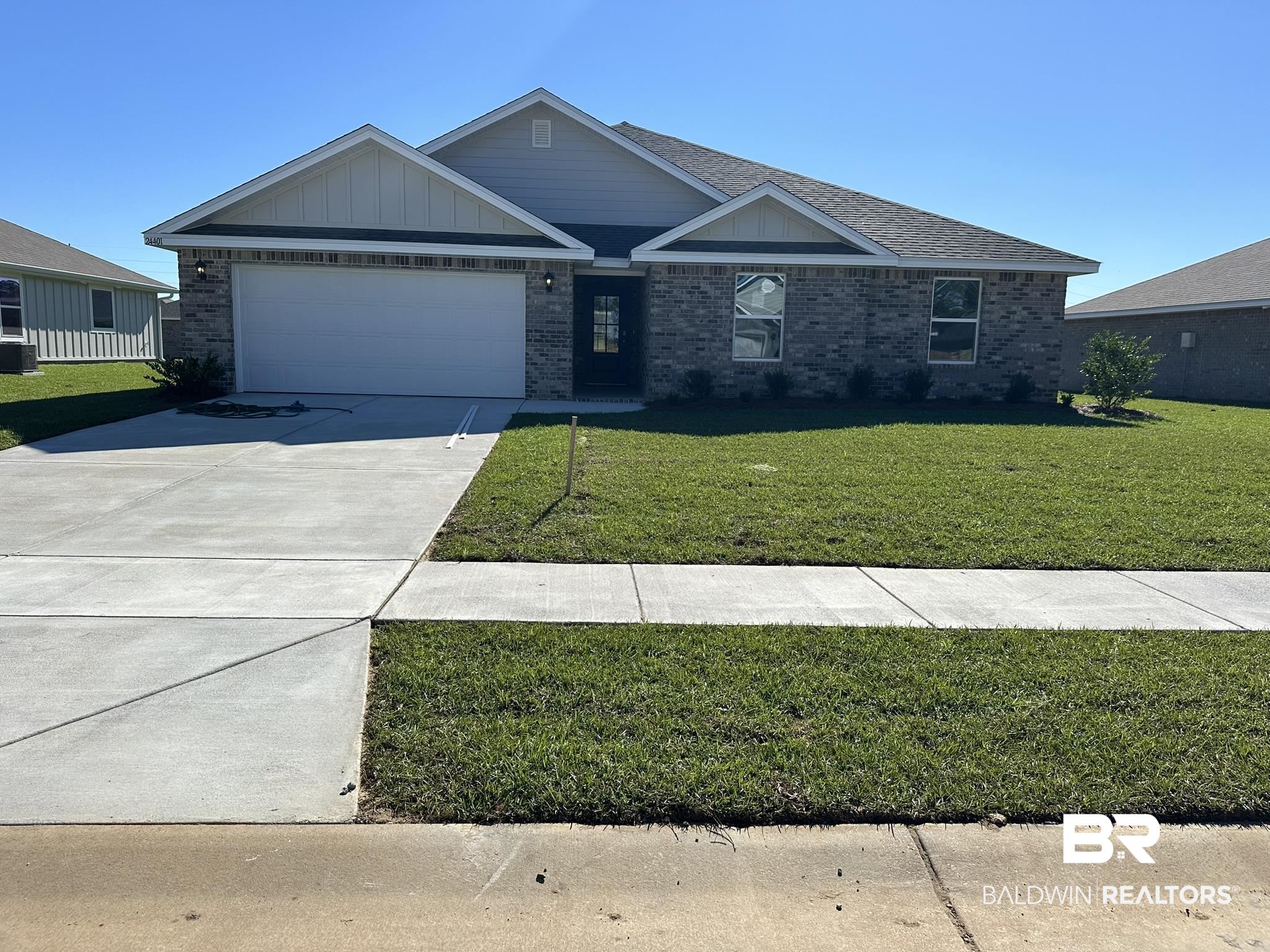 24401 Ringneck Loop Elberta, AL 36530 - Photo 1 of 3 View of front of property with a front yard and a garage