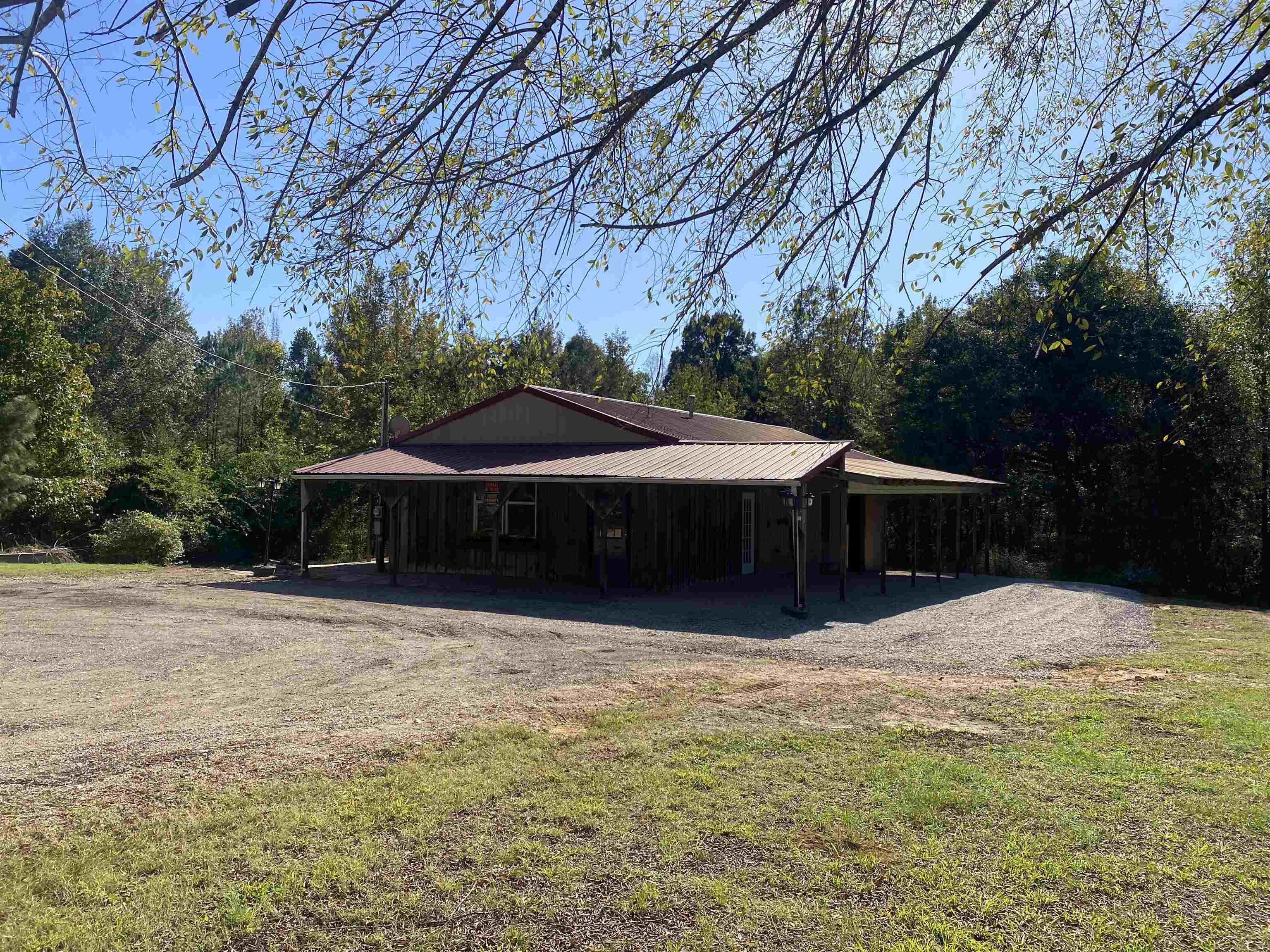 a front view of house with yard and trees