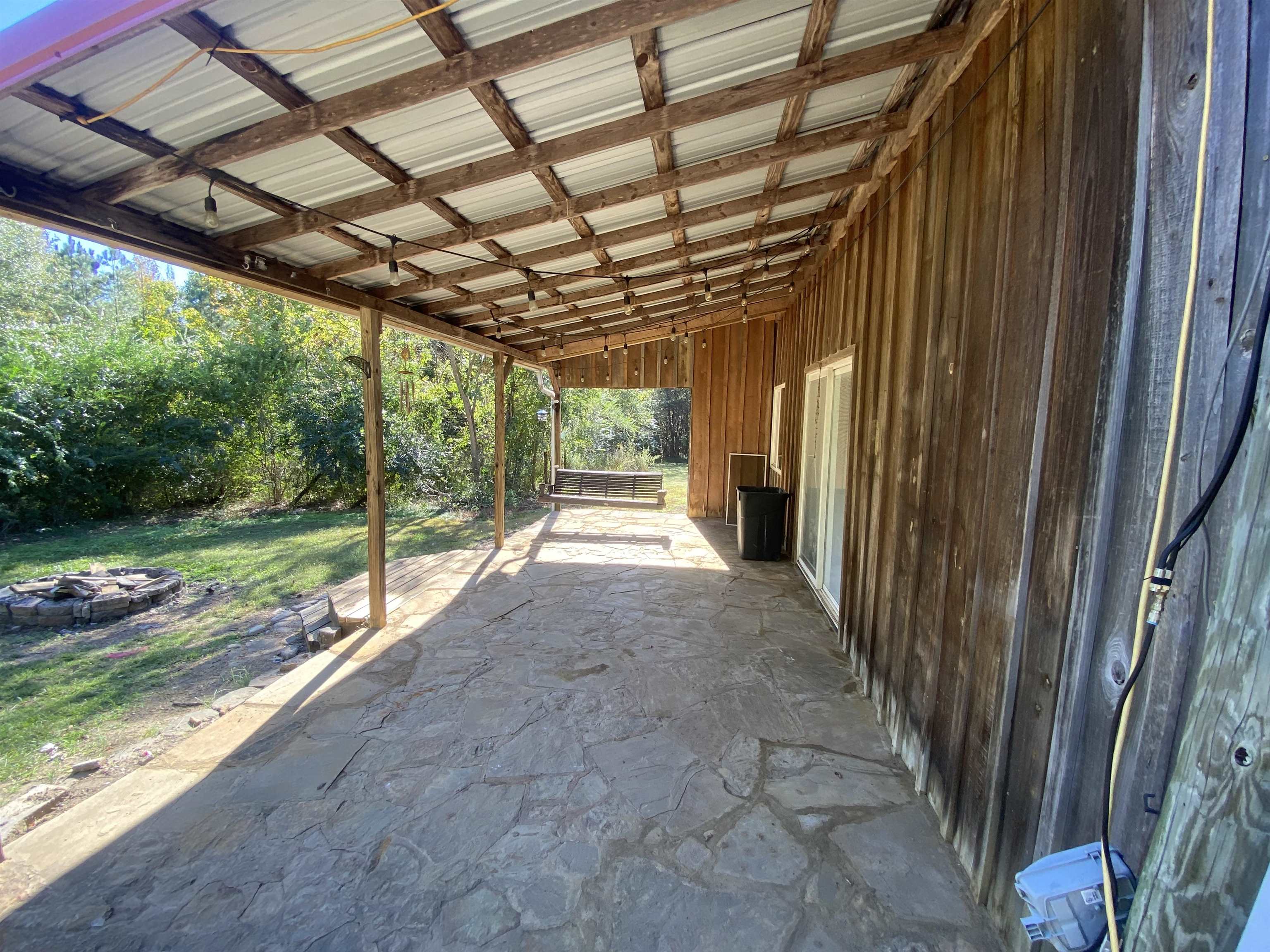 5610 Leapwood Enville Road Adamsville, TN 38310 - Photo 18 of 27 a view of a porch with a backyard