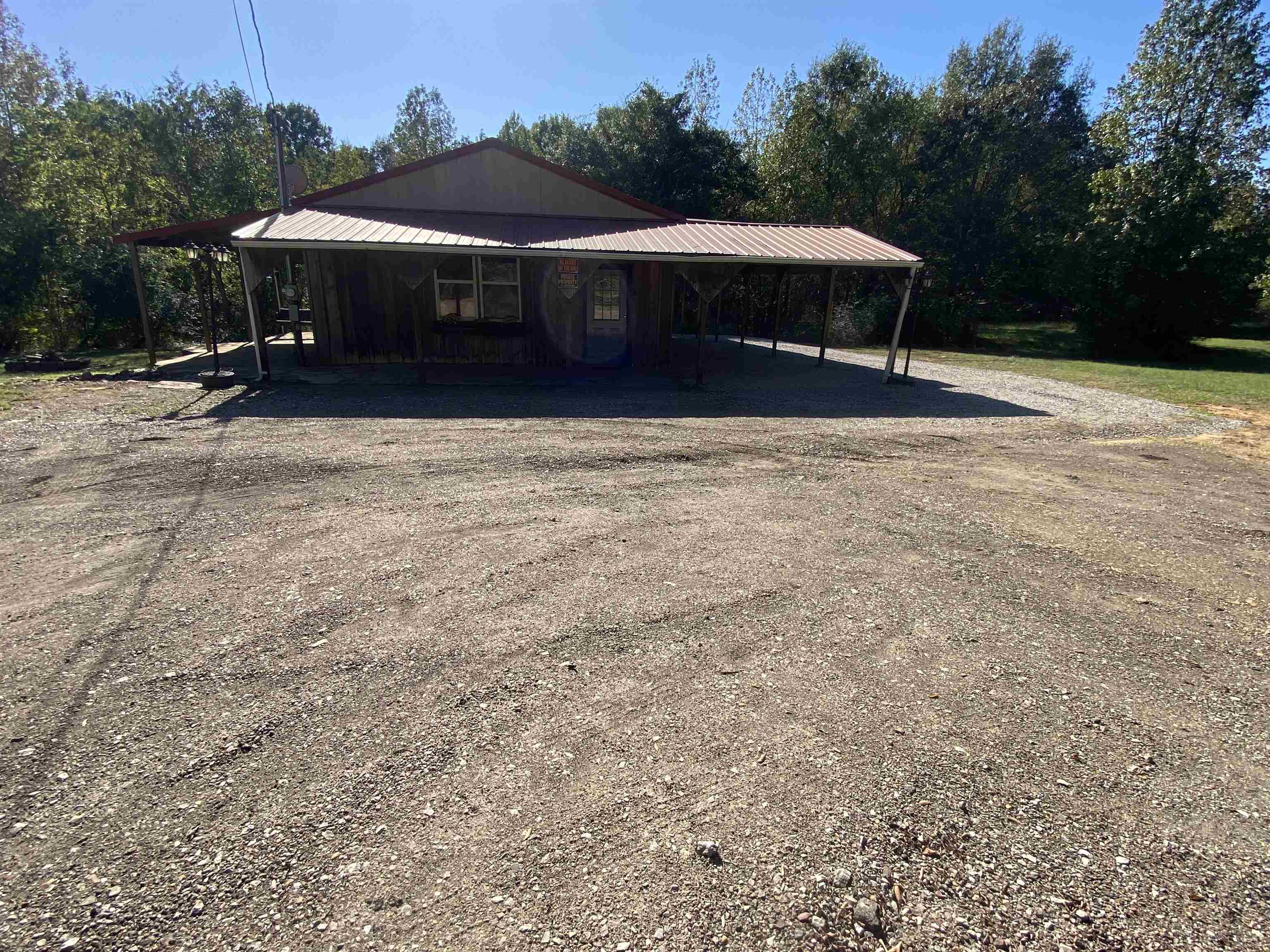 5610 Leapwood Enville Road Adamsville, TN 38310 - Photo 23 of 27 a front view of a house with a yard