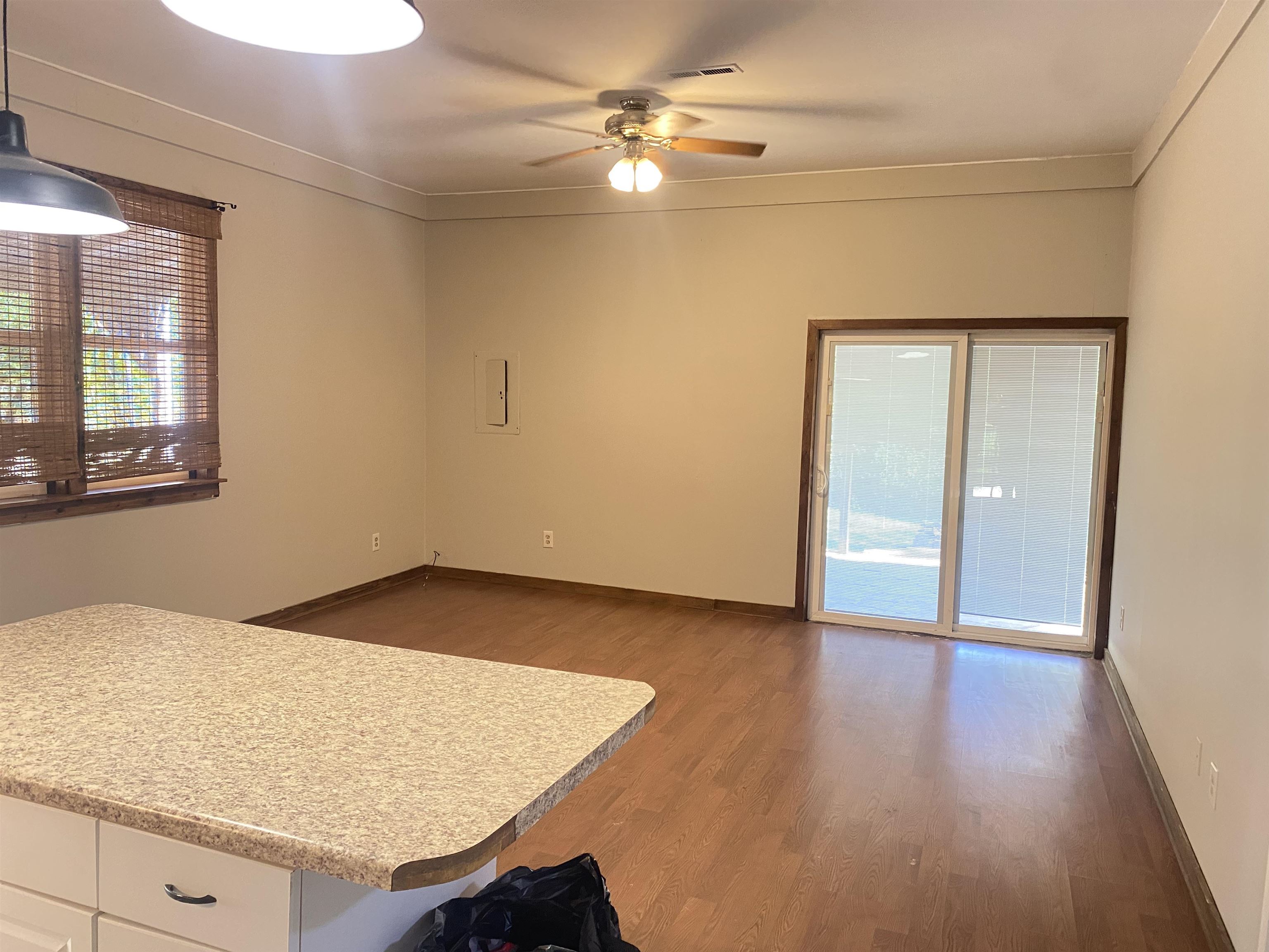 5610 Leapwood Enville Road Adamsville, TN 38310 - Photo 6 of 27 wooden floor in an empty room with a window