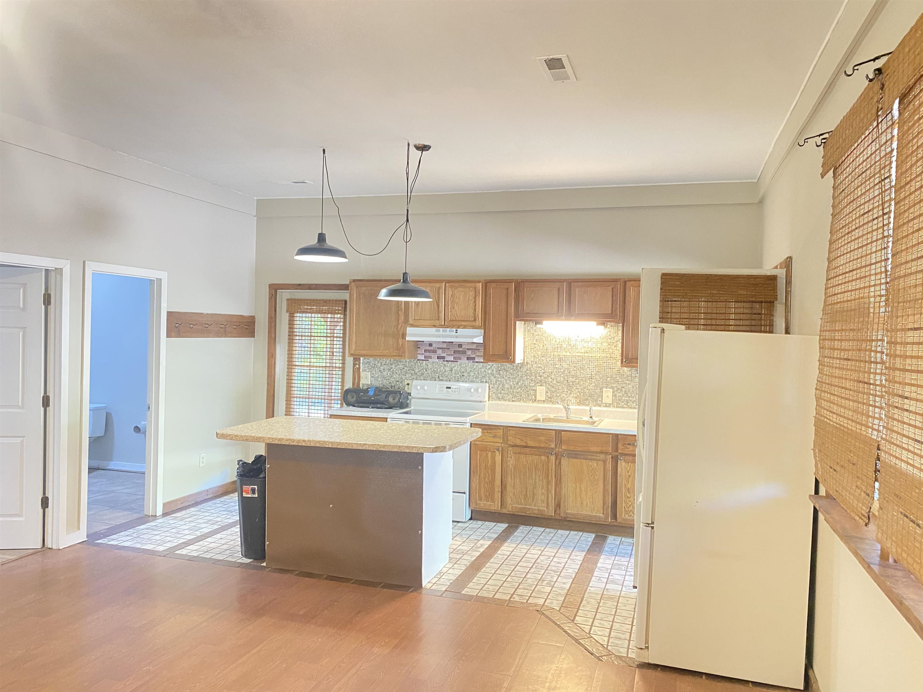 5610 Leapwood Enville Road Adamsville, TN 38310 - Photo 7 of 27 a kitchen with stainless steel appliances granite countertop a sink a stove and a refrigerator