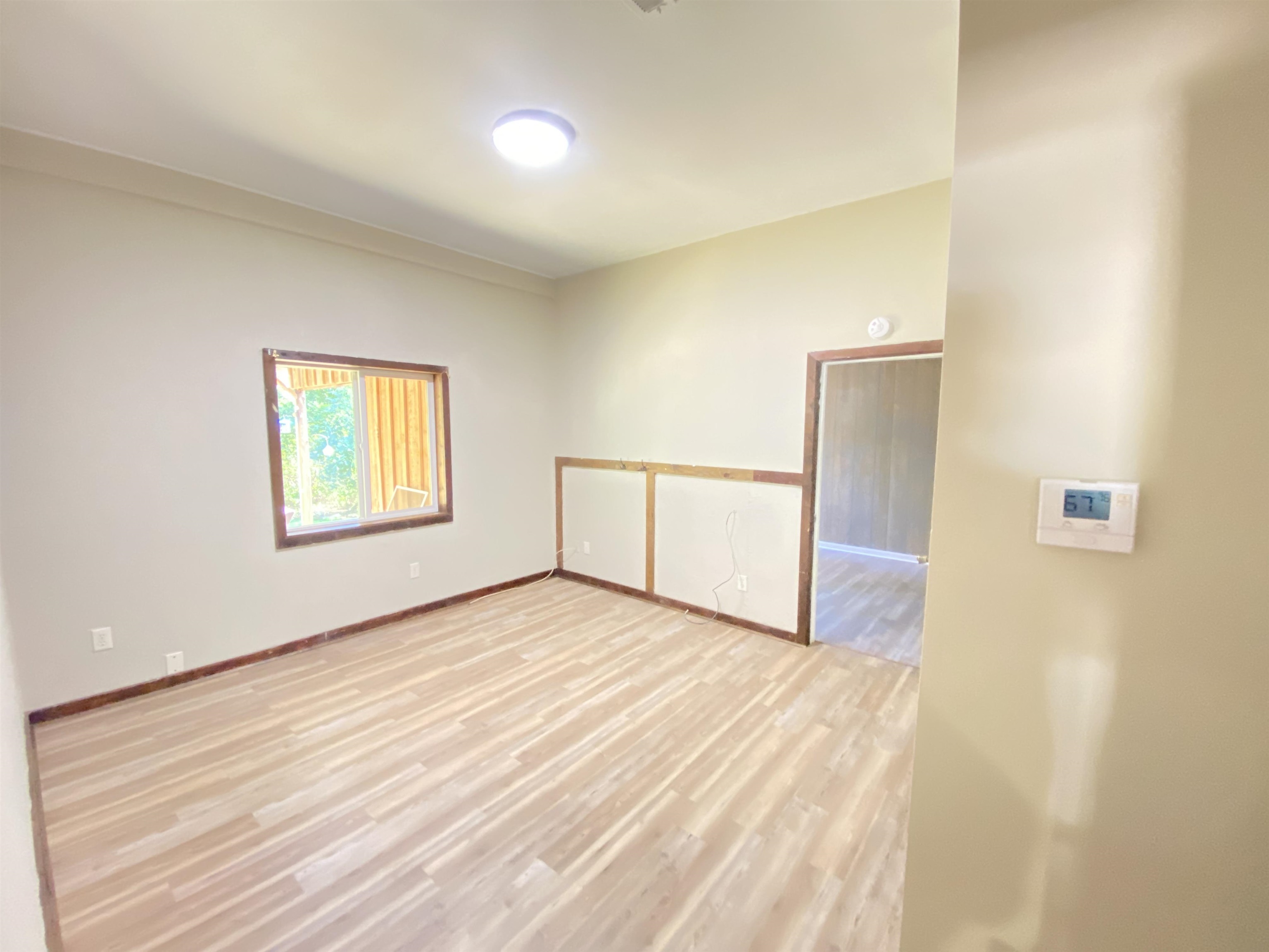 5610 Leapwood Enville Road Adamsville, TN 38310 - Photo 10 of 27 a view of an empty room with wooden floor