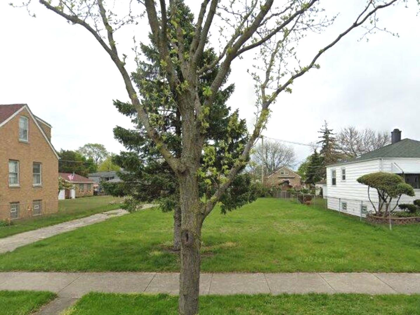 4515 Clinton Avenue Forest View, IL 60402 - Photo 1 of 1 a view of a garden with a tree