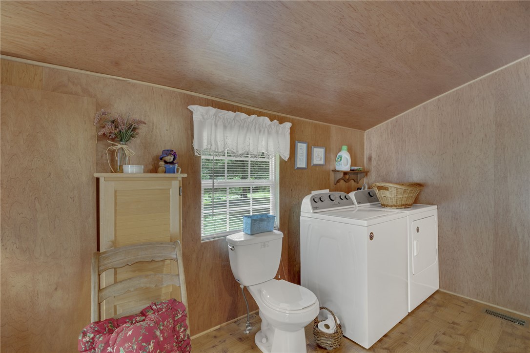 437 West Gate Road Pickens, SC 29671 - Photo 9 of 47 This functional utility space provides essential amenities for daily living.