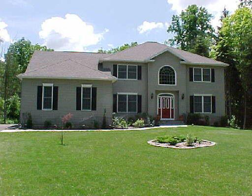55 River Ford Road Brookfield, CT 06804 - Photo 1 of 1 a front view of a house with a yard and garage