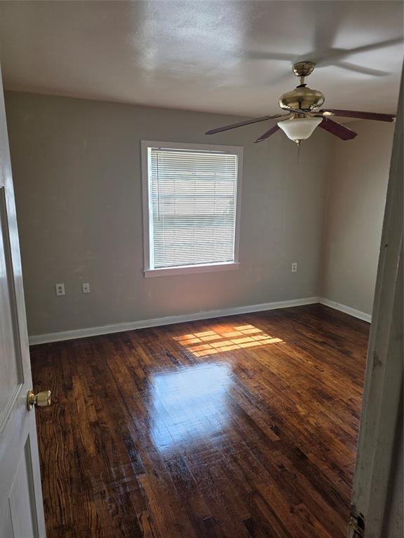 3609 Windsor Avenue Waco, TX 76708 - Photo 4 of 5 Spare room featuring dark wood-style flooring and a ceiling fan