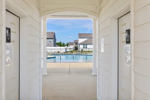 a view of a swimming pool with a lake view