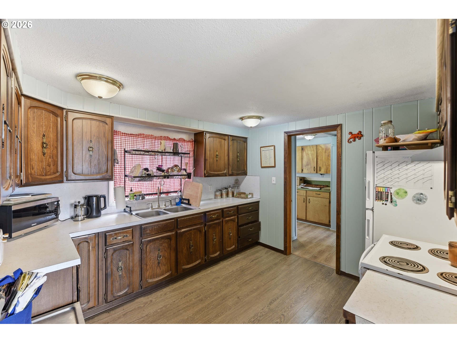 1955 Maple Street North Bend, OR 97459 - Photo 13 of 48 a kitchen with a sink appliances cabinets and a counter top space