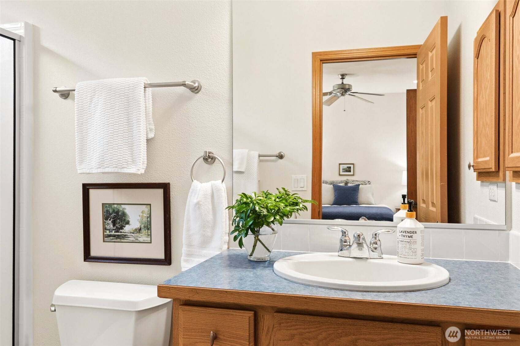 8232 Bainbridge Loop Northeast Lacey, WA 98516 - Photo 13 of 37 a bathroom with a sink toilet and mirror