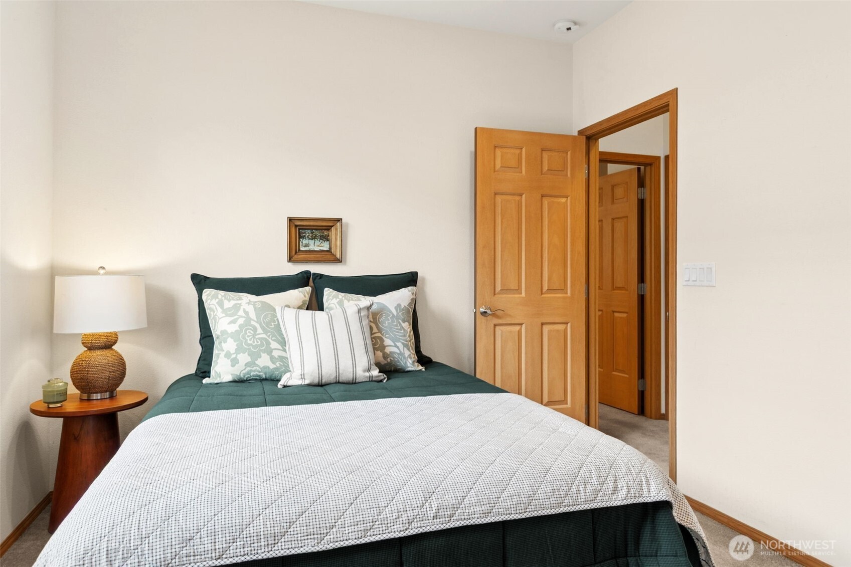 8232 Bainbridge Loop Northeast Lacey, WA 98516 - Photo 14 of 37 a bedroom with a bed and lamps