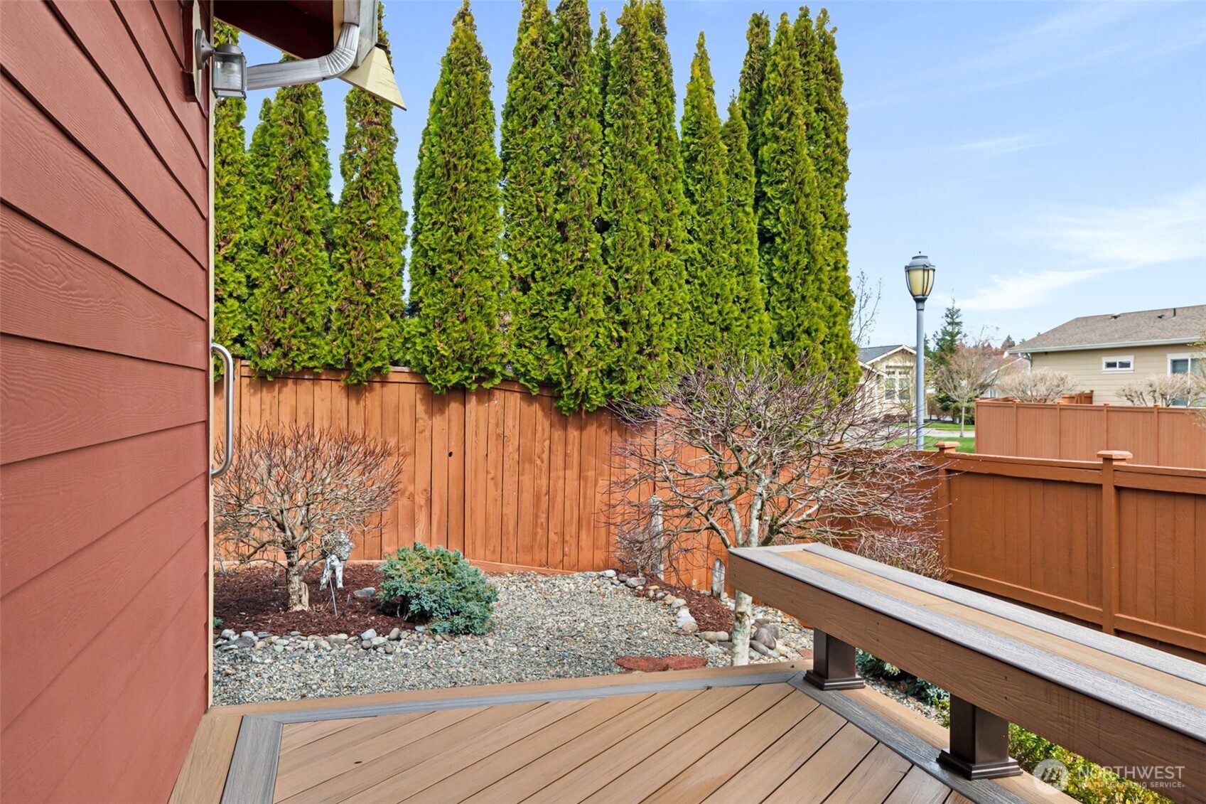 8232 Bainbridge Loop Northeast Lacey, WA 98516 - Photo 17 of 37 a view of balcony with wooden floor and fence