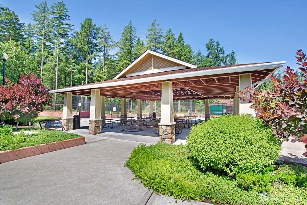 8232 Bainbridge Loop Northeast Lacey, WA 98516 - Photo 35 of 37 a view of a house with sitting area and garden
