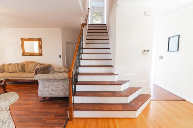 a view of a dining room with furniture and wooden floor