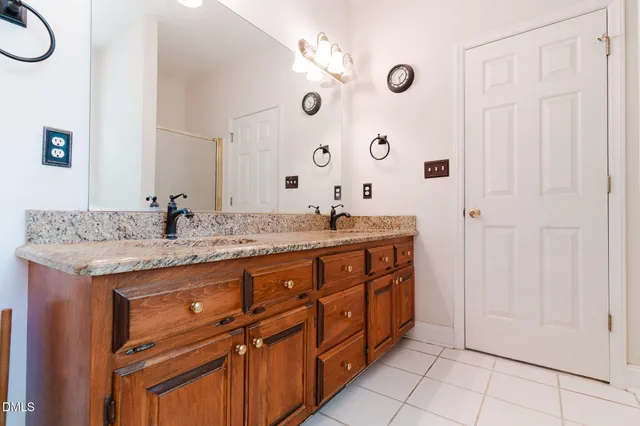 a bathroom with a tub sink and shower