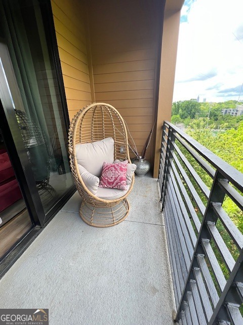 112 Rogers Street Southeast, Unit 504 Atlanta, GA 30307 - Photo 12 of 14 a view of a two chair in the balcony