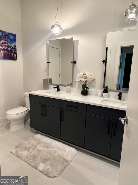 112 Rogers Street Southeast, Unit 504 Atlanta, GA 30307 - Photo 9 of 14 a bathroom with a sink vanity mirror and toilet