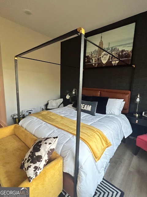 112 Rogers Street Southeast, Unit 504 Atlanta, GA 30307 - Photo 10 of 14 a bed sitting in a bedroom next to a window