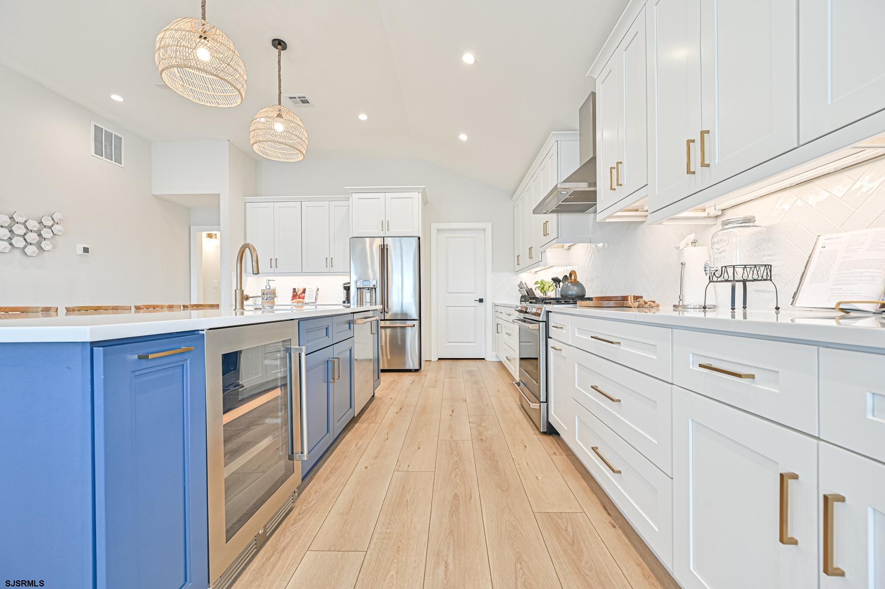 251 38th Street South Brigantine, NJ 08203 - Photo 11 of 63 a large kitchen with a large counter top appliances and cabinets