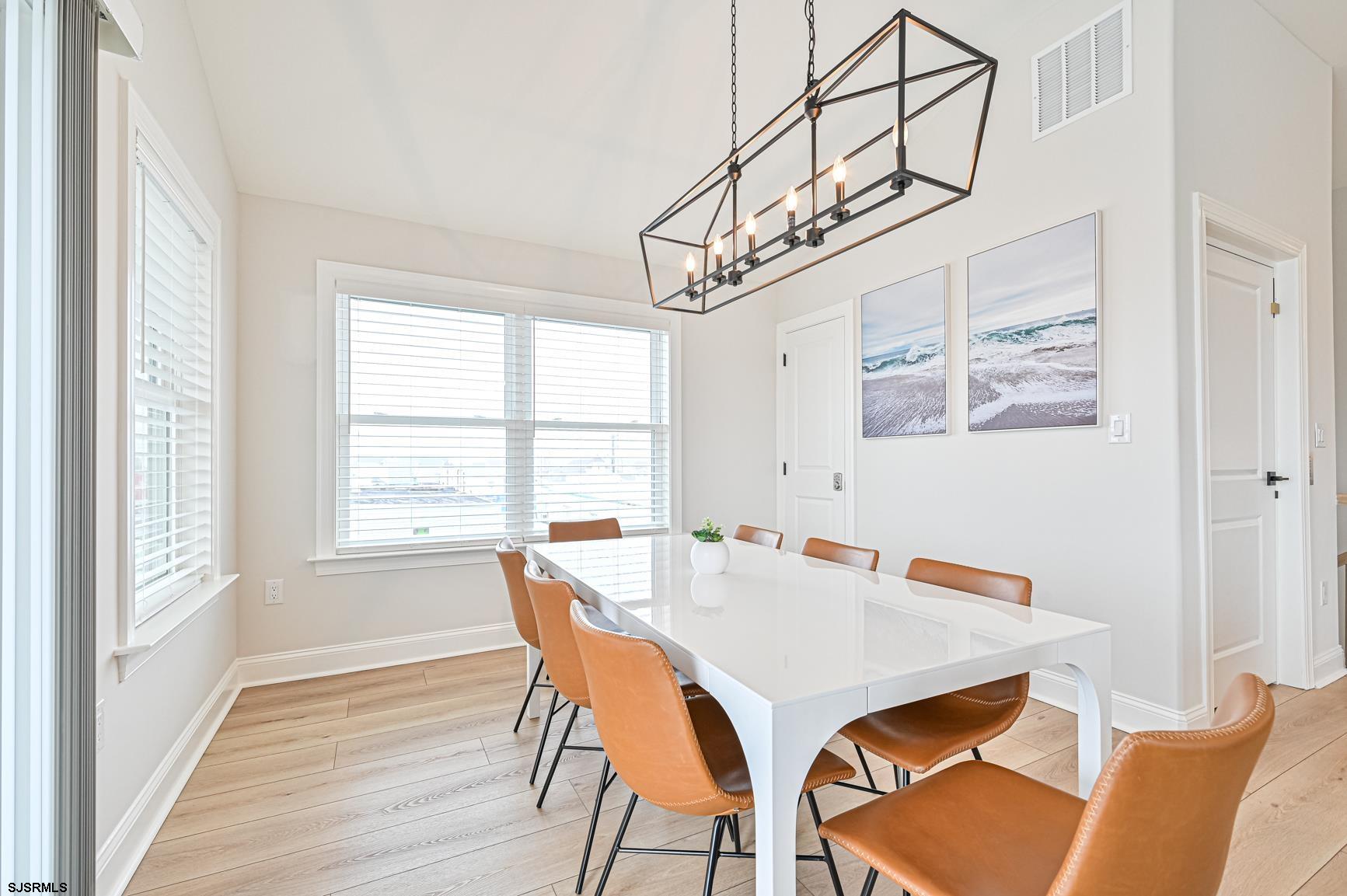 251 38th Street South Brigantine, NJ 08203 - Photo 16 of 63 a view of a dining room with furniture window and wooden floor