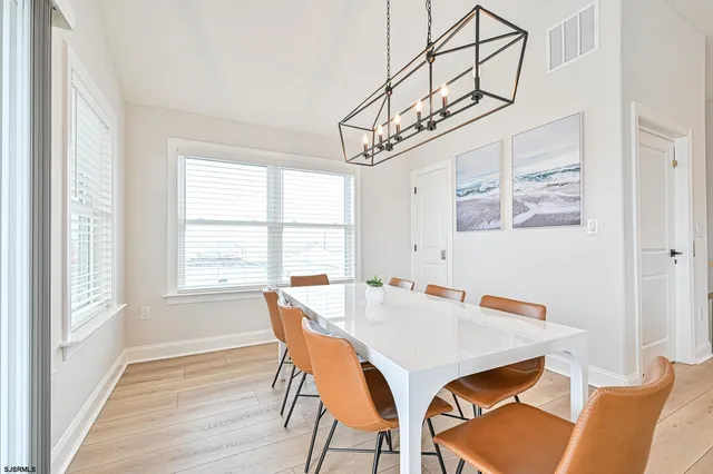 a view of a dining room with furniture and a table