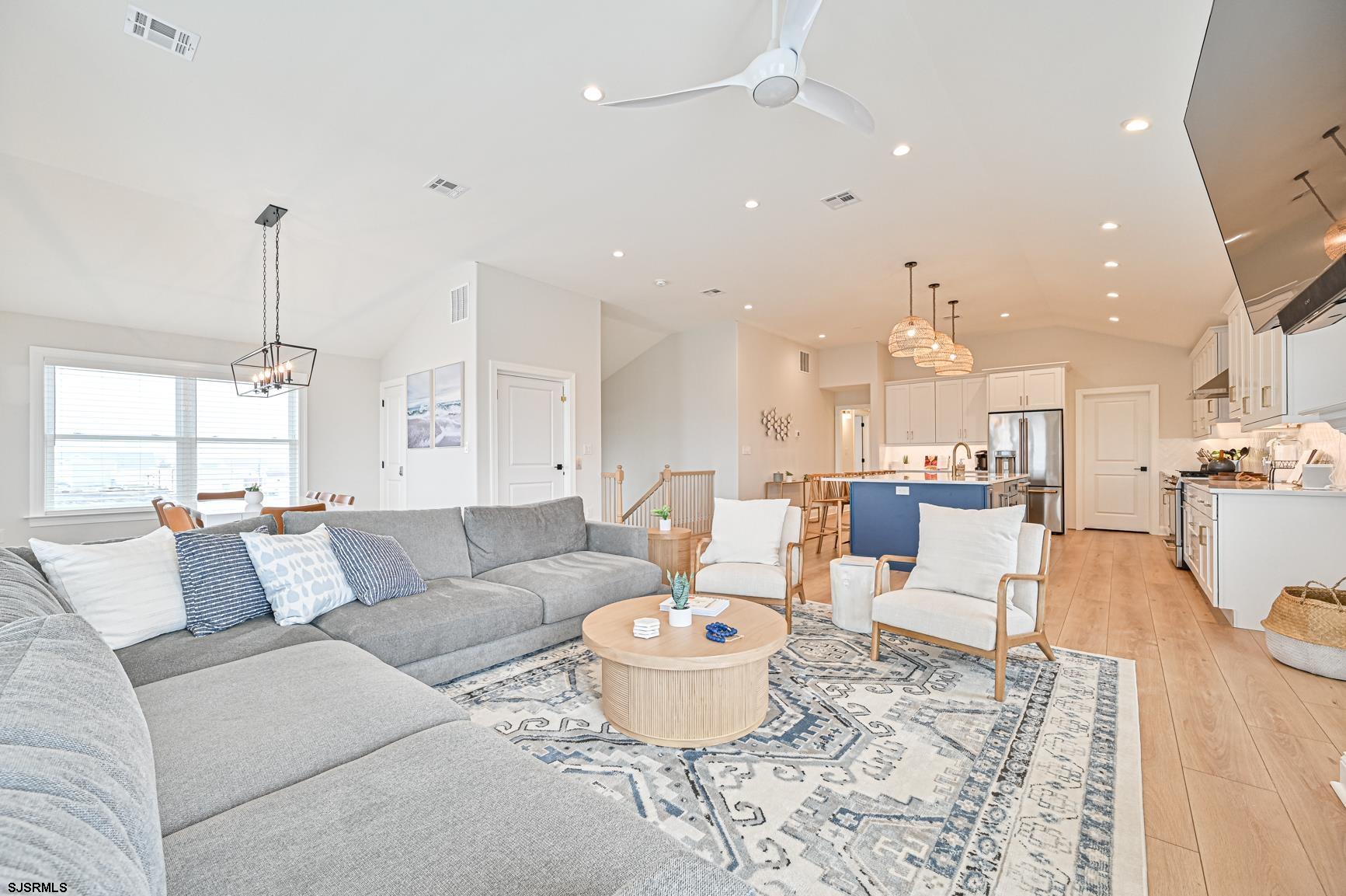 251 38th Street South Brigantine, NJ 08203 - Photo 20 of 63 a living room with furniture and a dining table