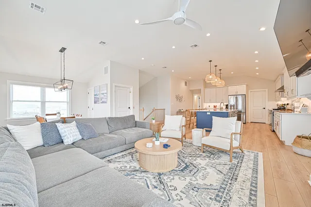 a large kitchen with lots of counter space and furniture