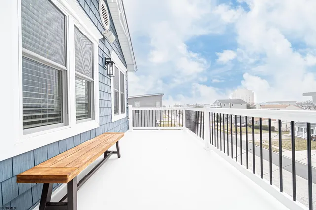 a white bath tub sitting next to a white sink