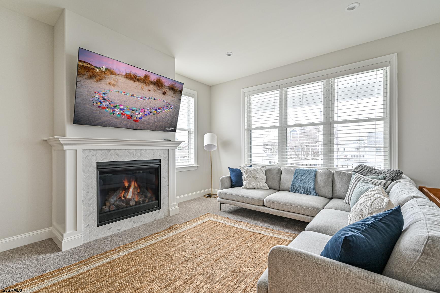 251 38th Street South Brigantine, NJ 08203 - Photo 36 of 63 a living room with furniture and a fireplace