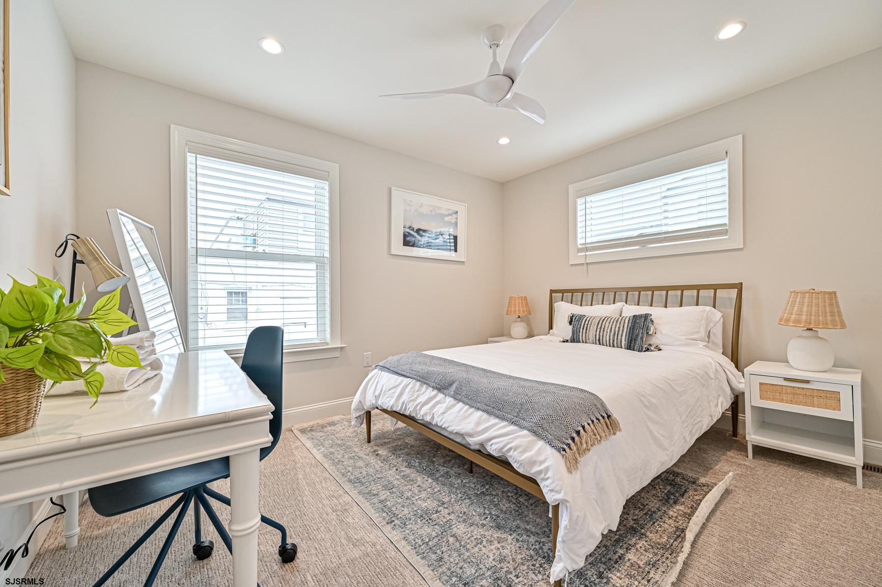 251 38th Street South Brigantine, NJ 08203 - Photo 42 of 63 a bedroom with a bed table chair and a window