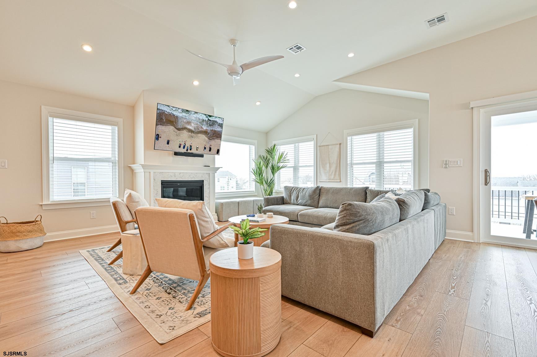 251 38th Street South Brigantine, NJ 08203 - Photo 49 of 63 a living room with furniture large window and wooden floor